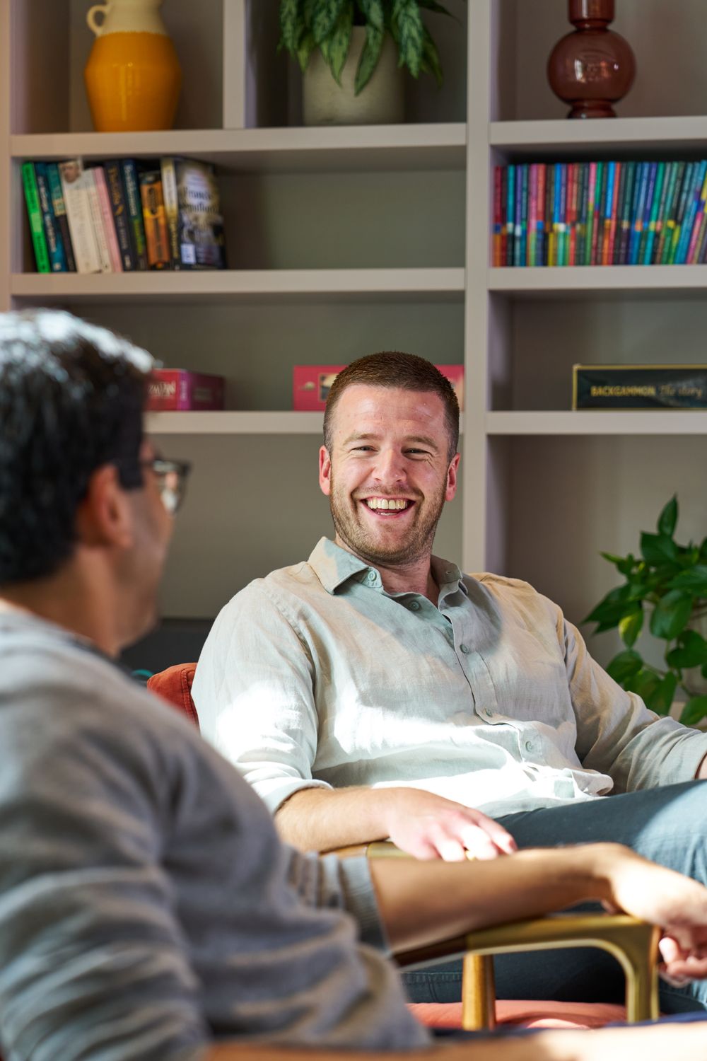 Staff members catching up in a breakout area.